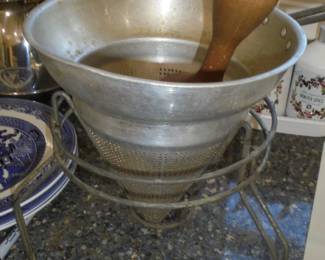 Vintage aluminum sieve with stand and wood masher 