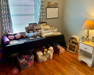 Large assortment of frames and home decor items