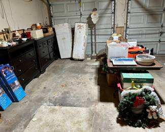 Garage items including more Christmas decor, nice furniture pieces, hand & lawn tools