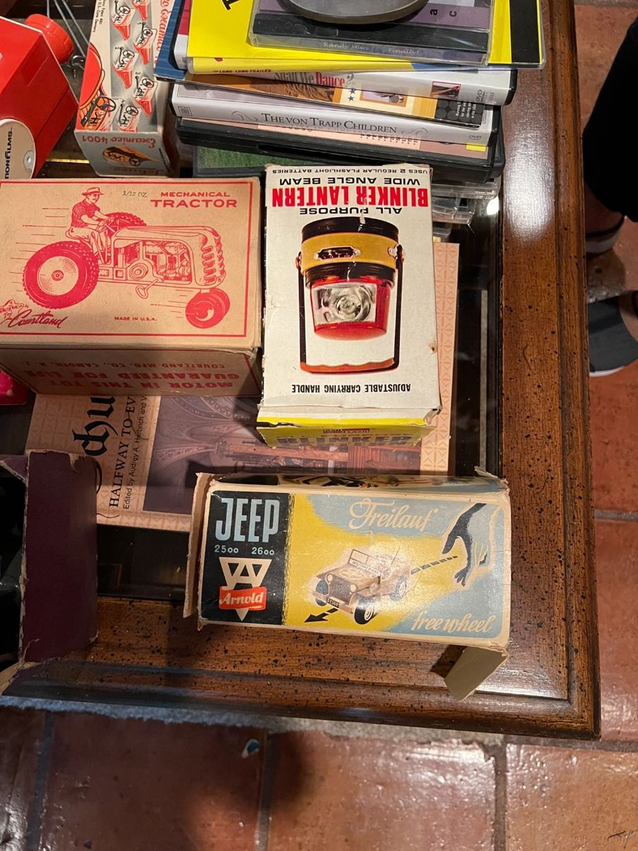 Children's vintage toys: Courtland mechanical tractor new in box, Blinker lantern, Freiland WWII era toy jeep.