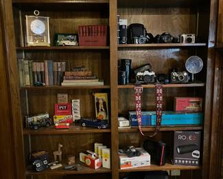 Vintage 35mm cameras and telephoto lenses in leather cases
