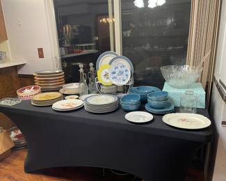 Dinner ware and metal steak platters with wooden bases