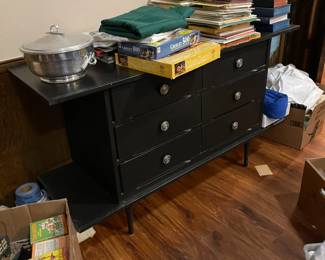 Mid century modern buffet with side shelves and three drawers.