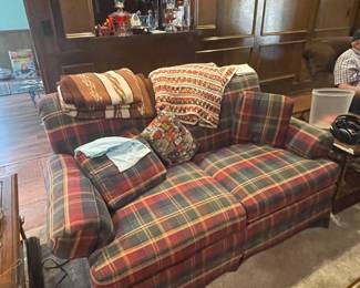 Red, navy, yellow plaid love seat.