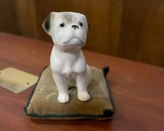 Vintage Hallmark bulldog figurine on velvet pillow.