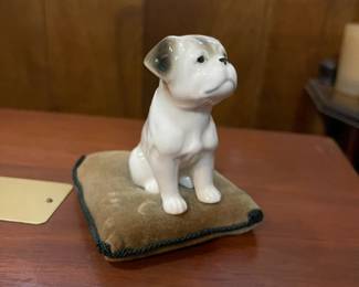 Vintage Hallmark bulldog figurine on velvet pillow.