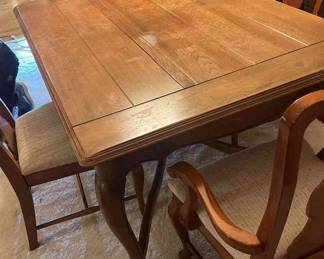 Dinning Room Table with four leaves 10 inch wide each