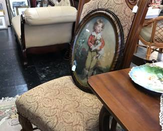 Love this gentlemens chair.  Notice oval convex frame of little dog and little boy.
