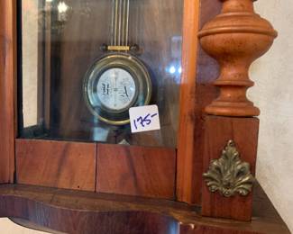 #200	 Wood Carved Clock w/Pendulum and key 11.5x28Tx6D 	 $175.00 
