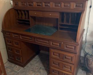 #30	Solid Wood Roll Top Desk - 13 Drawers w/cubbies and marble top. Dovetailed Drawers. 56x25x51 (as pictured chip)	 $500.00 
