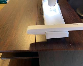 #146	Koala Brazilian Cherry Sewing Cabinet w/Front Storage Shelves and additional Storage in Back.  Comes with an additional extension Table mounted on the back to extra quilting/sewing workspace.  Purchased from S & R Sewing in Huntsville.  In excellent condition  - DesignerCenter Plus IV - 70 Horizontal by 45.5D x 29.25 High 	 $2,000.00 
