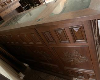 #29	Carved Wood Folding Bar w/Applique Floral Doors. Green Marble Inlay top. 4 Door shelves, w/wine glass hooks. 4 interior drawers, 9 spot wine rack and, 2 shelves. 35-62x18x40	 $800.00 
