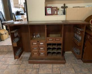 #29	Carved Wood Folding Bar w/Applique Floral Doors. Green Marble Inlay top. 4 Door shelves, w/wine glass hooks. 4 interior drawers, 9 spot wine rack and, 2 shelves. 35-62x18x40	 $800.00 
