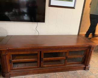 #32	Entertainment Center/TV Stand - 3 sliding glass doors, 3 shelves,74x27x24	 $175.00 
