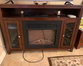 #4	Fireplace tv stand with 2 doors and shelf  57x15x40Dream flame  - as is 	 $300.00 
