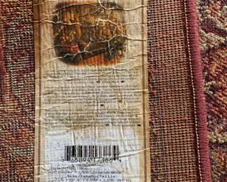 #73	Shaw machine made rug with rust and navy  7x9	 $100.00 
