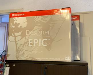 #198	Husqvarna Viking Designer Epic Sewing and Embroidery Machine w/all included Attachments including the largest hoop on the market approx 10x14 with User manuals, Extra feet, extra hoops , walking foot, bobbins, cords and much more.  In excellent condition and working order.  	 $3,000.00 
