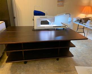 #146	Koala Brazilian Cherry Sewing Cabinet w/Front Storage Shelves and additional Storage in Back.  Comes with an additional extension Table mounted on the back to extra quilting/sewing workspace.  Purchased from S & R Sewing in Huntsville.  In excellent condition  - DesignerCenter Plus IV - 70 Horizontal by 45.5D x 29.25 High 	 $2,000.00 
