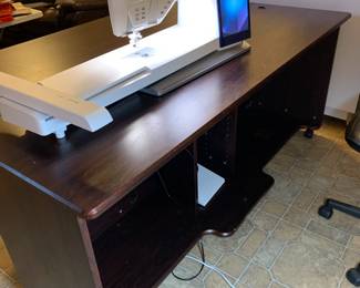 #146	Koala Brazilian Cherry Sewing Cabinet w/Front Storage Shelves and additional Storage in Back.  Comes with an additional extension Table mounted on the back to extra quilting/sewing workspace.  Purchased from S & R Sewing in Huntsville.  In excellent condition  - DesignerCenter Plus IV - 70 Horizontal by 45.5D x 29.25 High 	 $2,000.00 
