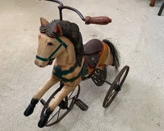 #101	antique horse on wheels wood as is crack leg  22 tall	 $40.00 
