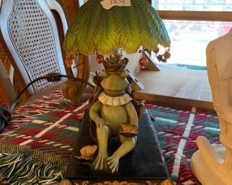 #124	frog king  lamp with flower shade 12 inches tall 	 $75.00 
