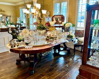 HUGE antique Empire dining table with claw feet stuffed full of beautiful things.