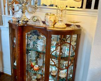 Another curio cabinet full of porcelain and pressed glass.  Notice the luster lamp.
