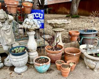 Pots and concrete planters.  Lots of succulents in pots.