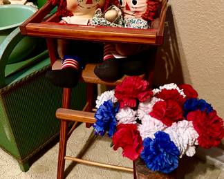 Vintage high chair with Raggedy Ann and Andy.