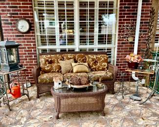 Nice backyard with all weather wicker sofa and coffee table.