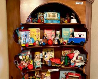 Corner pine hutch full of vintage Fisher Price.