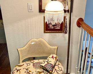Sweet caned back crewel vanity stool.  So many lamps in this house.