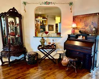 Antique organ, art, heavily carved curio cabinet full of cranberry glass and Swarovski!
