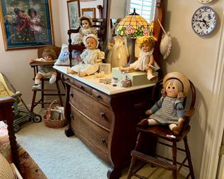 Nice antique dresser with marble top.  Multiple high chairs with sweet dolls!