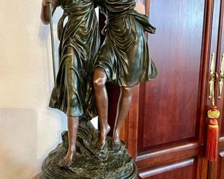 Large statue on stand.