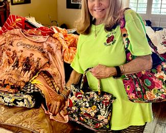 Kim showing off some of the Vera Bradley purses during prep!