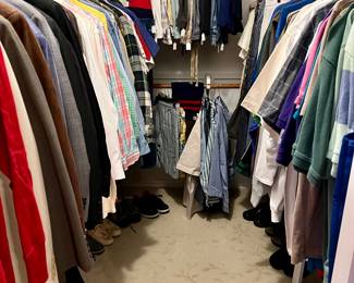 Nice walk-in full of men's clothing.