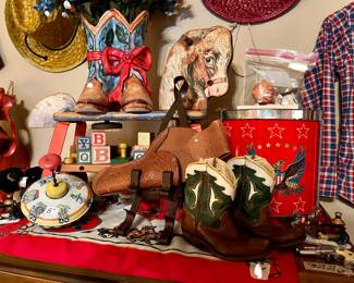 See the vintage boots, tin spinning top, drum, and Fisher Price rolling horse?