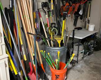 The garden tool section.  Many never used shovels, forks, hoes and rakes