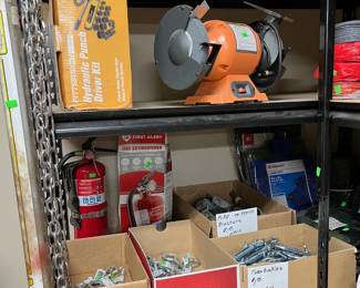 Lots of chain link fence parts and rolls of fencing as well