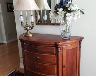 DEMI LUNE CHEST,WATERFORD CRYSTAL AND BRASS LAMP & FLORAL ARRANGEMENT