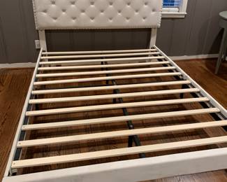 Queen size bed in perfect shape. No mattress available. Fabric upholstery.