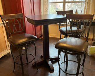 Awesome bar top table with three barstools that swivel!