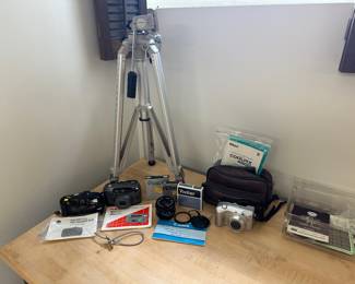 Tripod and Vintage Film and Digital Camera Gear.