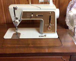 singer sewing machine in cabinet
