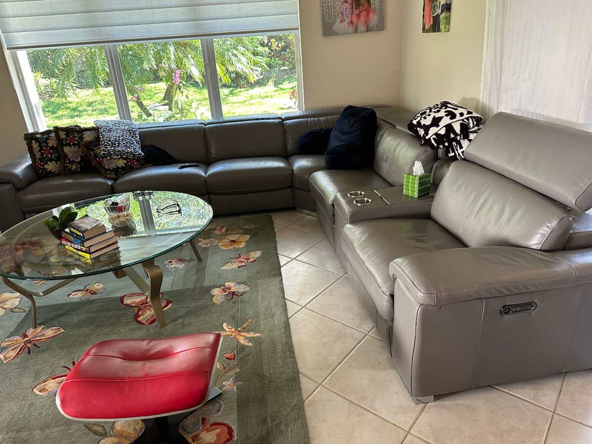 large living room gray real  leather sofa with 3 recliners 121x74x13x38.  - Original price $10,990 selling for  $3500.                  Rug is 8x10 - $200  cocktail table $395

