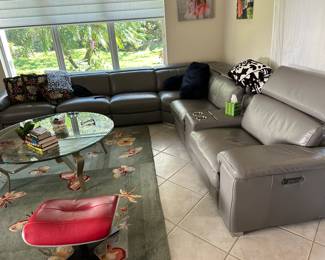 large living room gray real leather sofa with 3 recliners 121x74x13x38. - Original price $10,990 selling for $3500. Rug is 8x10 - $200 cocktail table $395