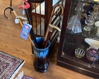 Well, this umbrella stand is probably a vase and let me tell you it is heavy and absolutely stunning and signed