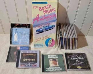 CD Mystery Lot Including Phil Collins, Ella Fitzgerald And Barry White
The Beach Music Anthology box set and 18 other CDs on their cases.