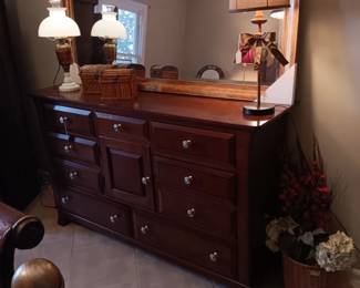 New gold frame mirror and triple dresser.